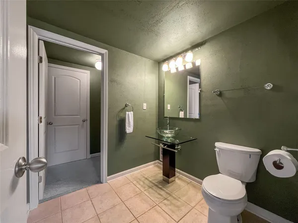 a bathroom with a toilet and a sink