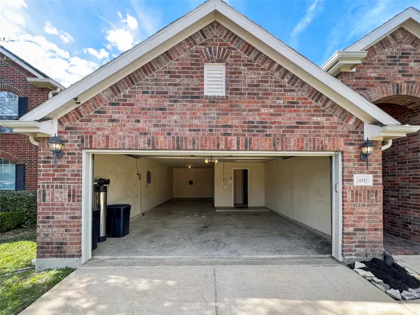 a front view of a house with a garage