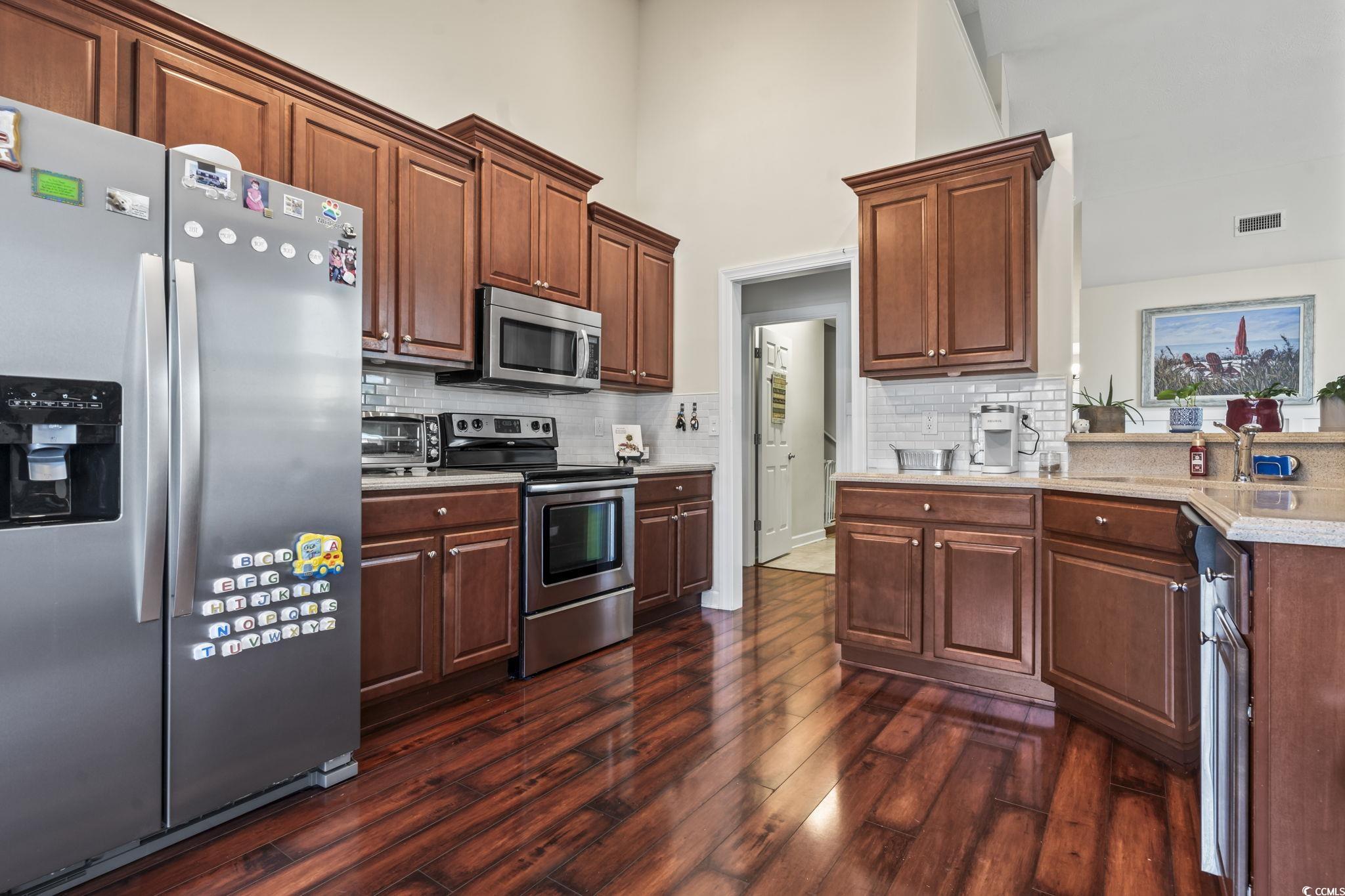 3141 Shorecrest Bay Drive Murrells Inlet, SC 29576 - Photo 12 of 30 Kitchen featuring stainless steel appliances, dark