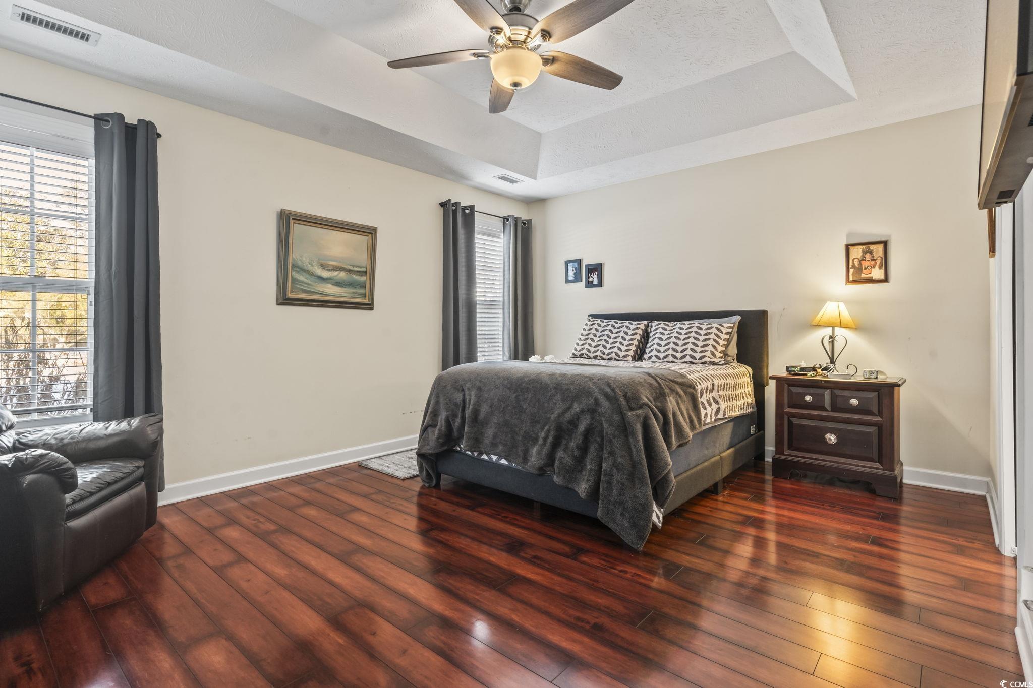 3141 Shorecrest Bay Drive Murrells Inlet, SC 29576 - Photo 15 of 30 Bedroom featuring a raised ceiling, dark wood-type