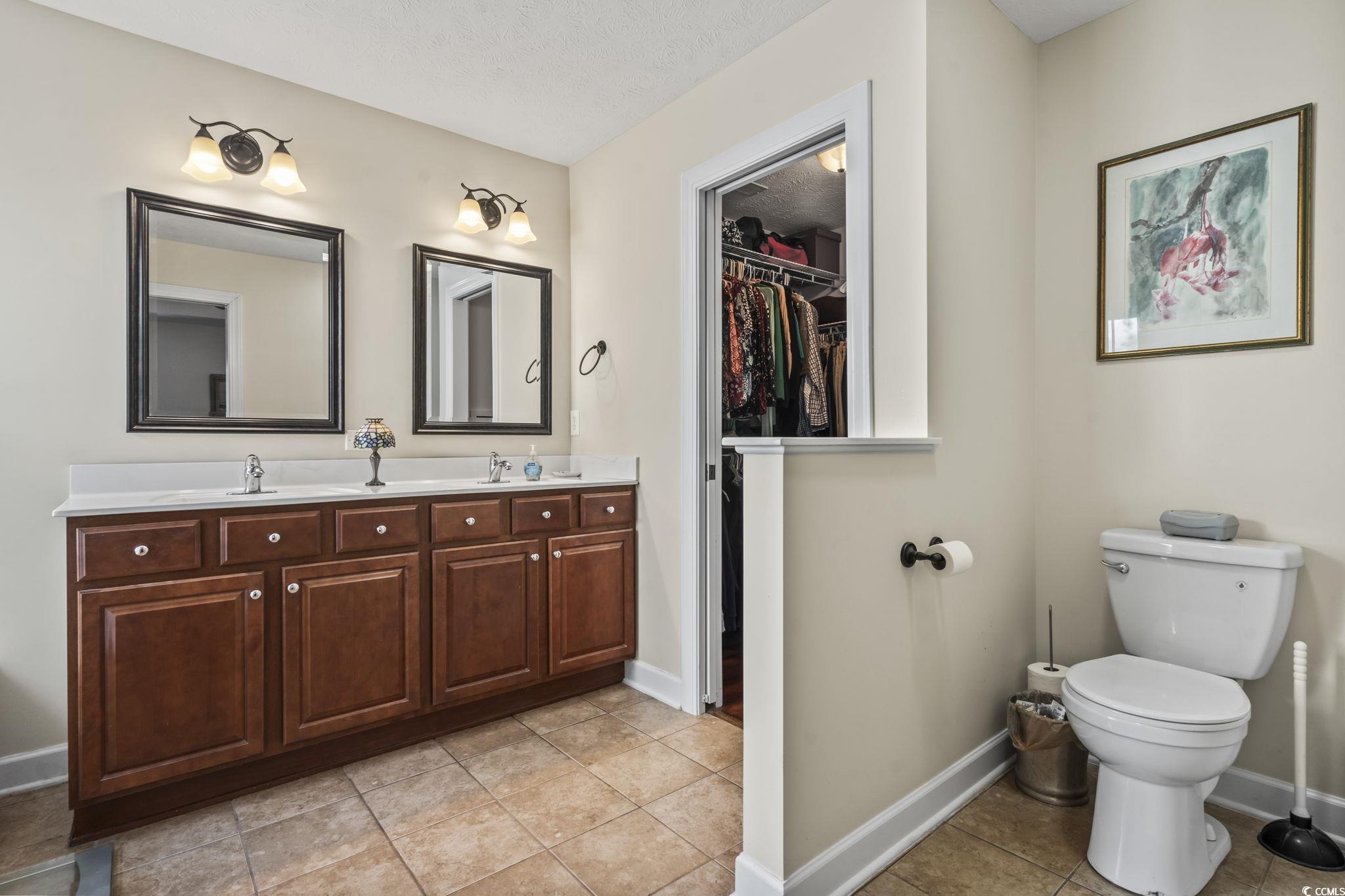 3141 Shorecrest Bay Drive Murrells Inlet, SC 29576 - Photo 21 of 30 Bathroom with vanity, tile patterned floors, toile