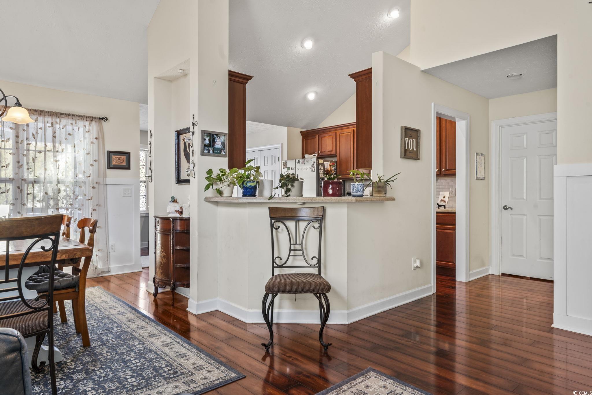 3141 Shorecrest Bay Drive Murrells Inlet, SC 29576 - Photo 3 of 30 Kitchen featuring dark wood-type flooring, vaulted