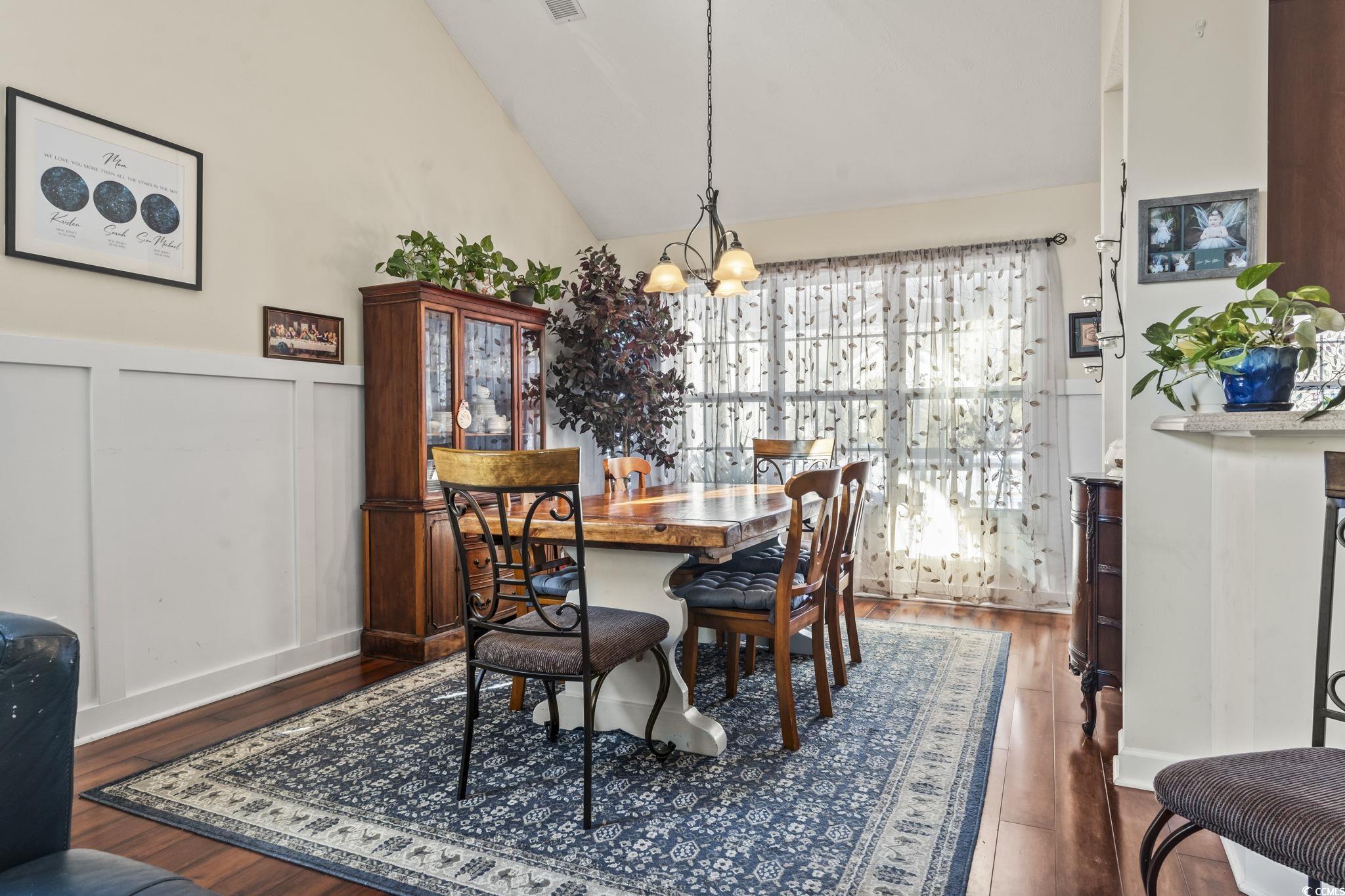 3141 Shorecrest Bay Drive Murrells Inlet, SC 29576 - Photo 9 of 30 Dining space with a notable chandelier, dark wood-