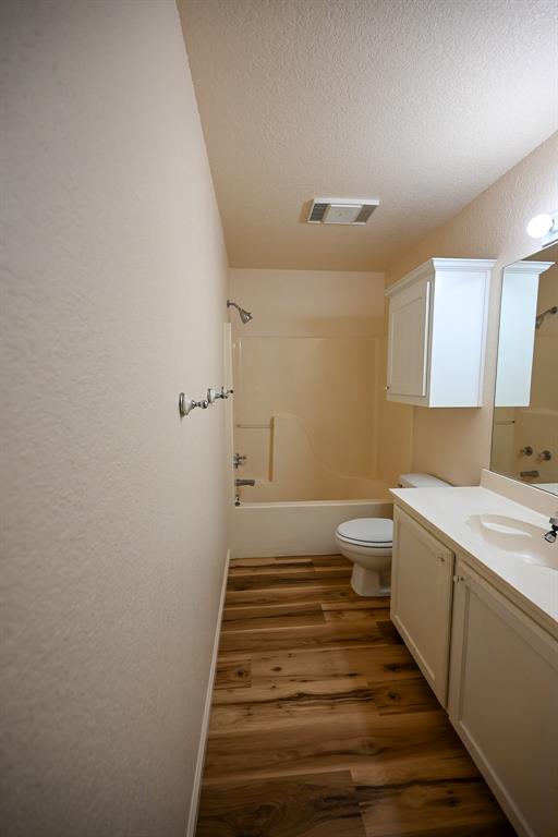 3201 South Garland Street Decatur, TX 76234 - Photo 5 of 20 a bathroom with a sink and toilet