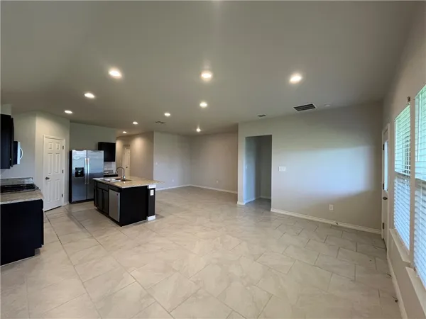 an open space with kitchen view