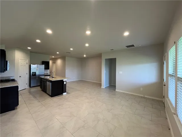 an open space with kitchen view