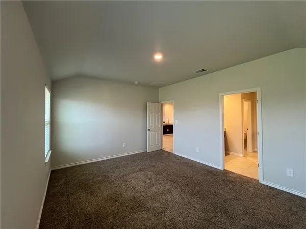 a view of an empty room and window