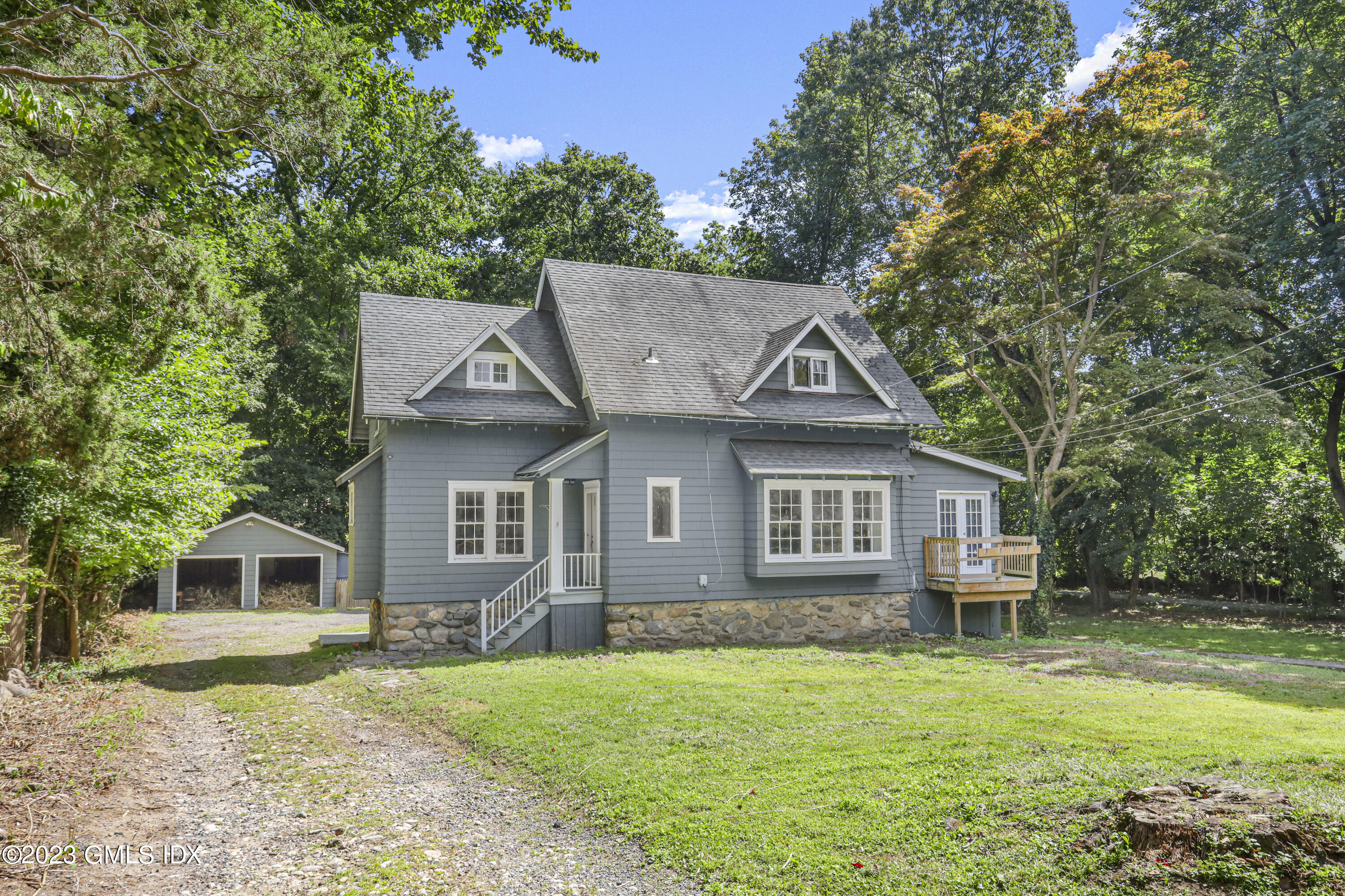 33 Breezemont Avenue Riverside, CT 06878 - Photo 21 of 31 front view of a house with a yard