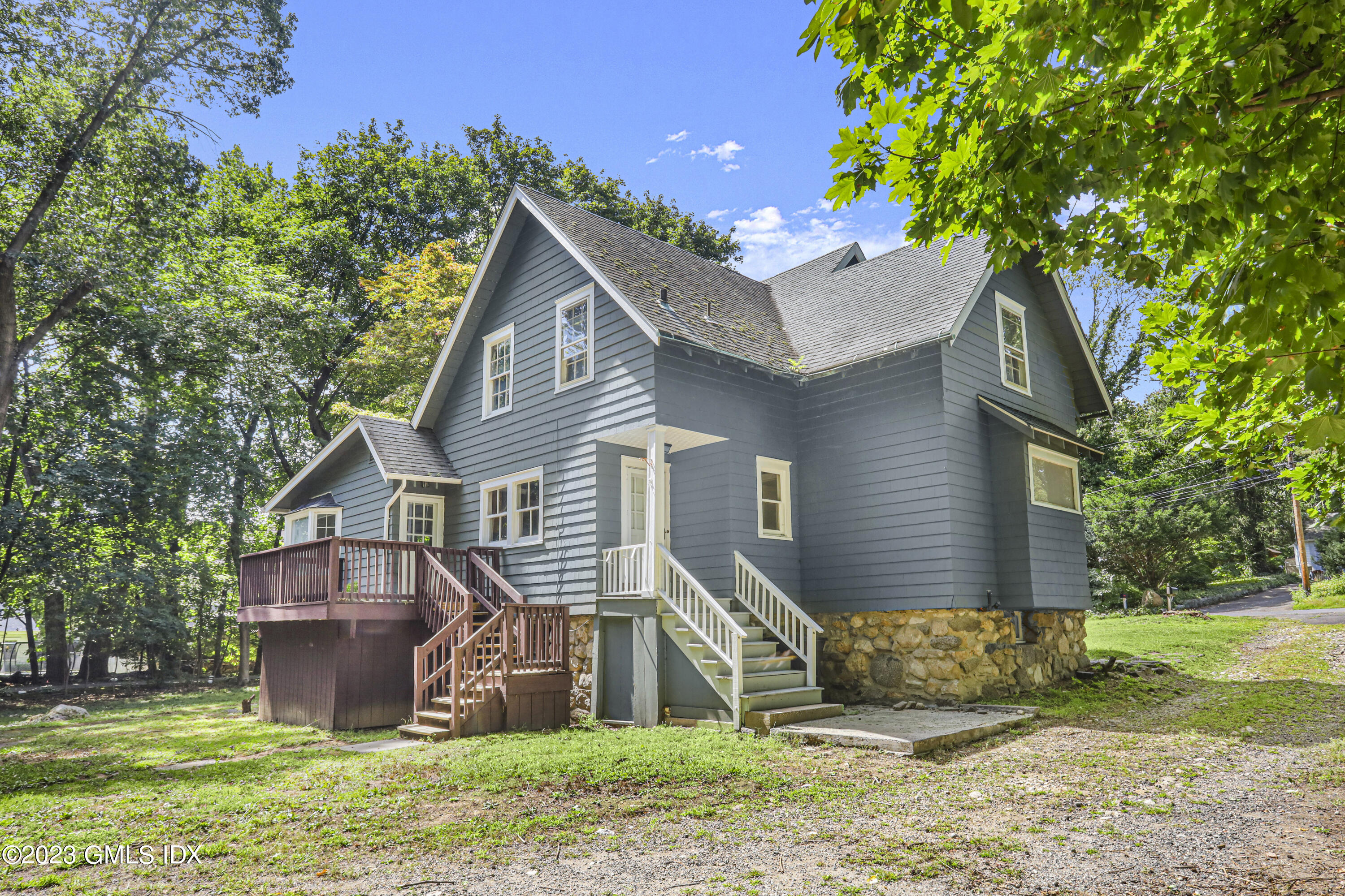 33 Breezemont Avenue Riverside, CT 06878 - Photo 23 of 31 a front view of a house with a yard