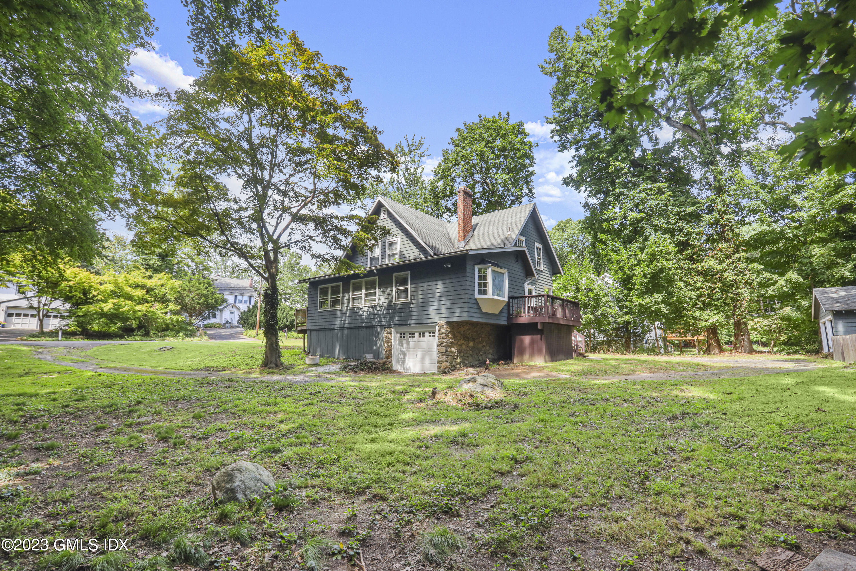 33 Breezemont Avenue Riverside, CT 06878 - Photo 24 of 31 a view of a house with a yard
