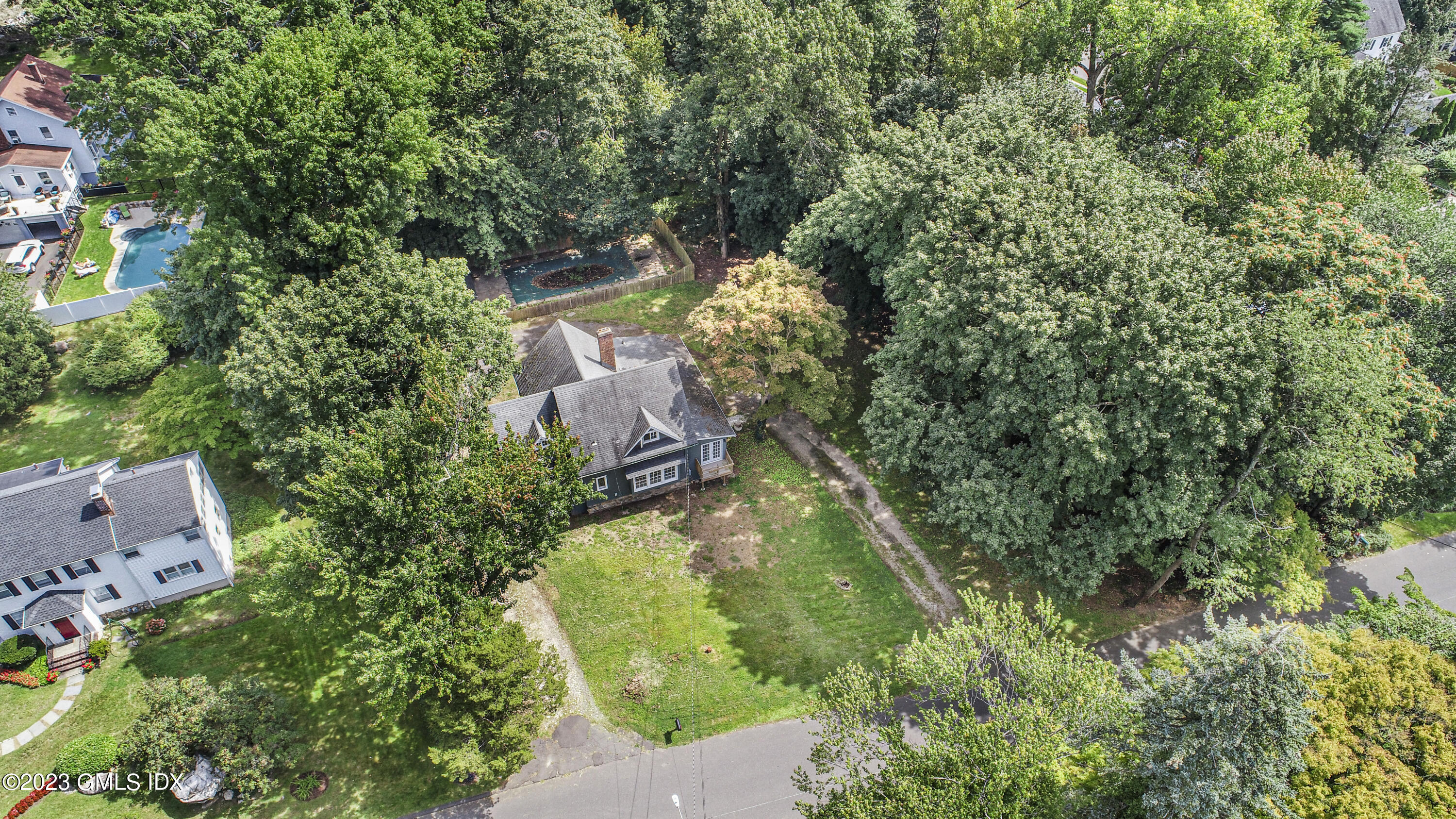 33 Breezemont Avenue Riverside, CT 06878 - Photo 26 of 31 an aerial view of residential house with outdoor space and trees all around