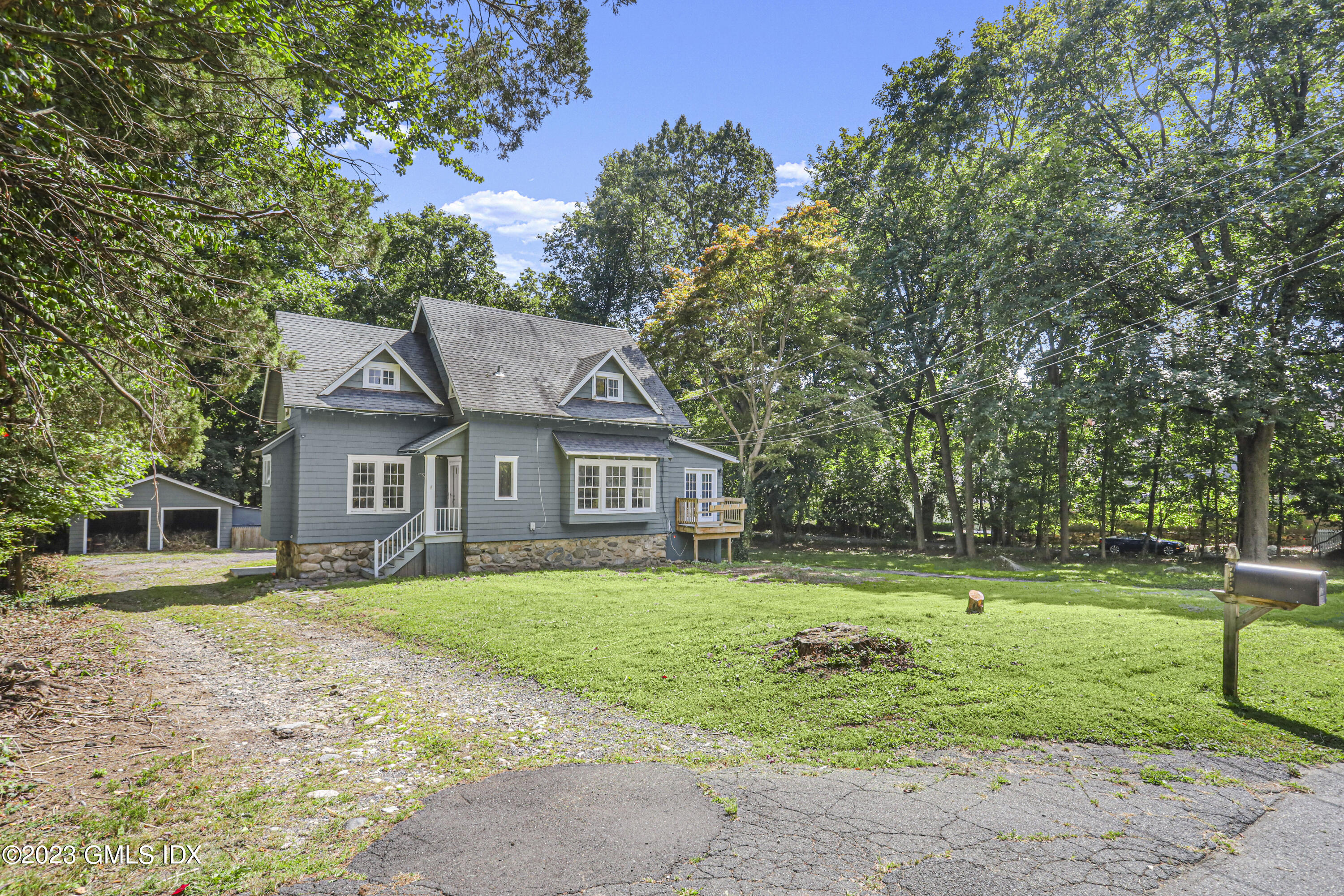 33 Breezemont Avenue Riverside, CT 06878 - Photo 5 of 31 a front view of a house with a yard