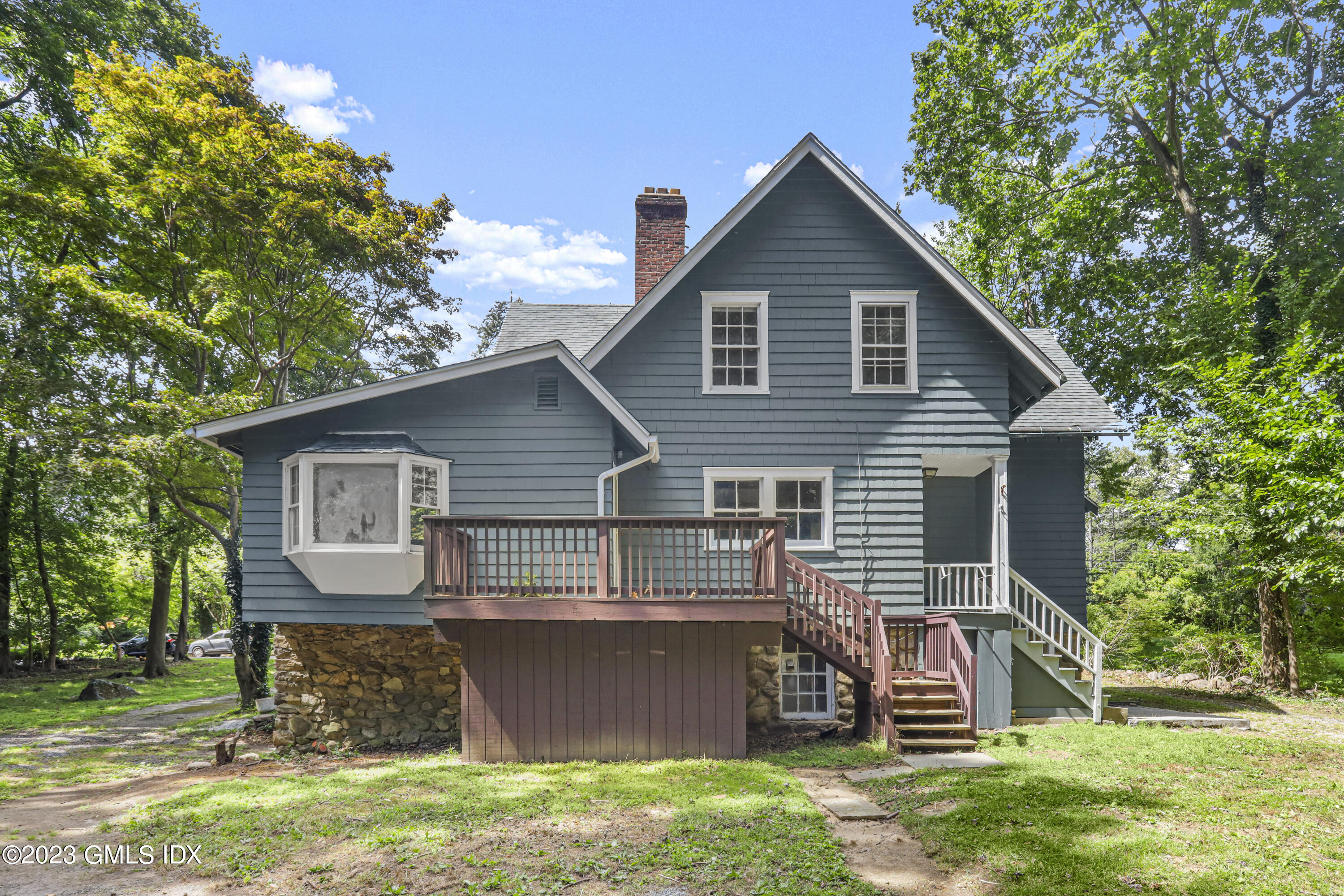 33 Breezemont Avenue Riverside, CT 06878 - Photo 7 of 31 a front view of a house with a yard
