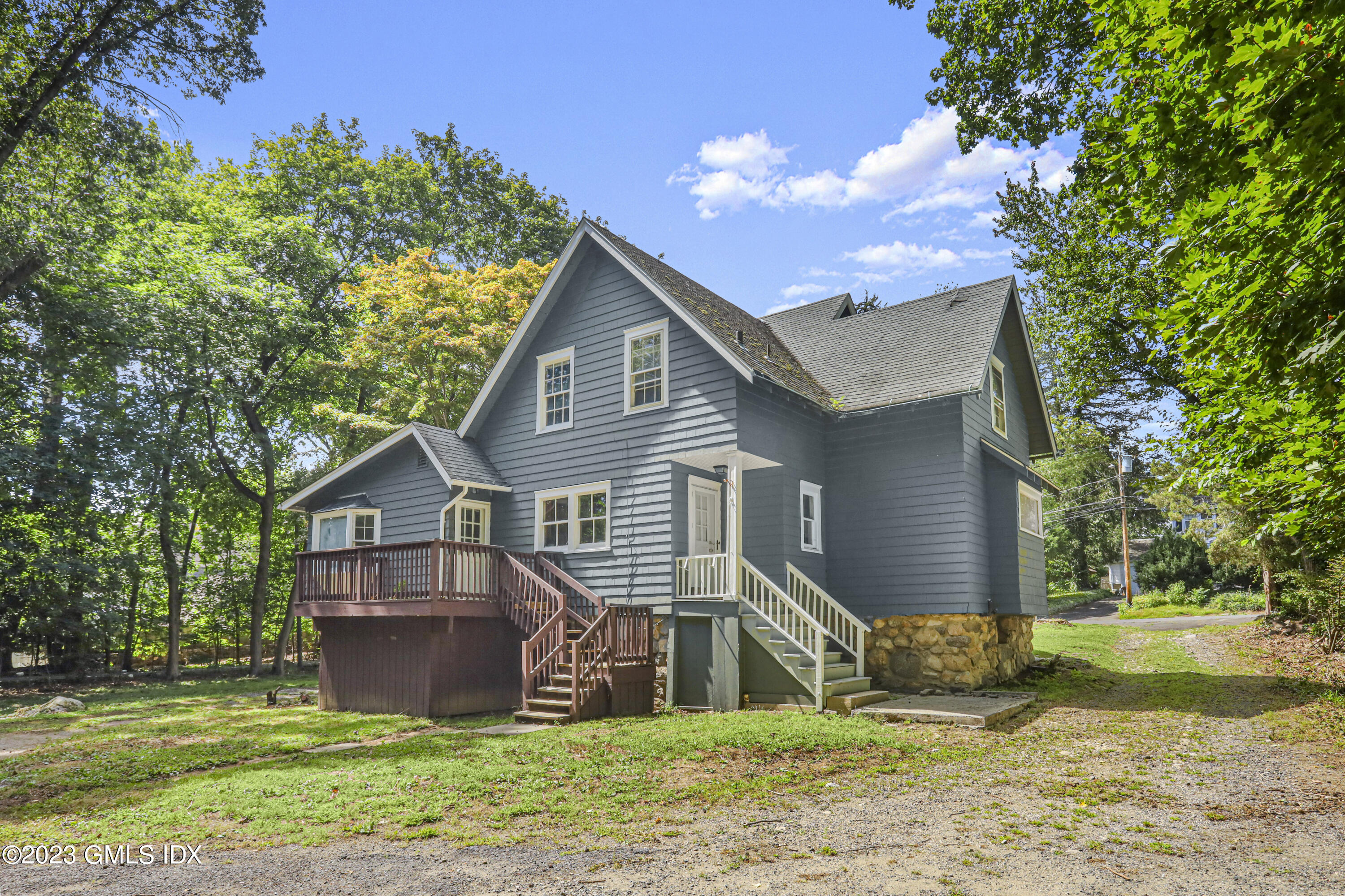 33 Breezemont Avenue Riverside, CT 06878 - Photo 8 of 31 a view of a house with a yard