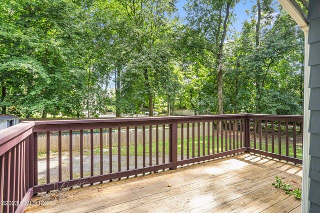 a view of balcony with wooden floor