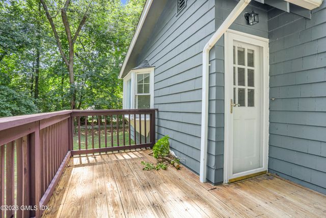 a view of a wooden house with a large window