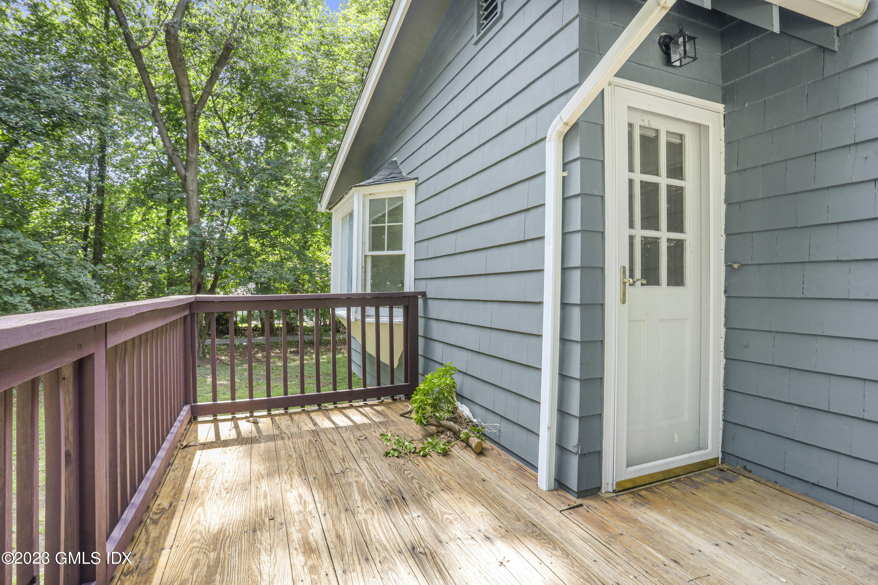 33 Breezemont Avenue Riverside, CT 06878 - Photo 10 of 31 a view of a wooden house with a large window