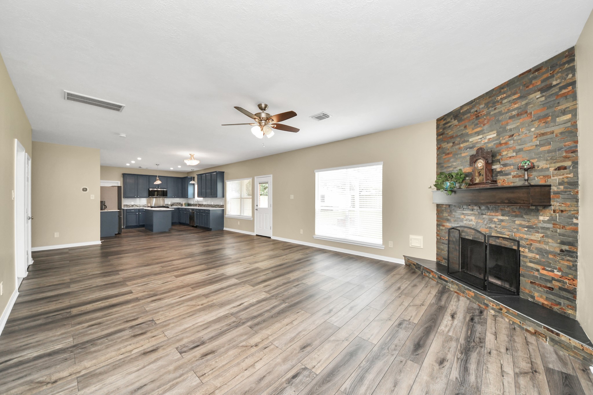 7622 McCormick Mill Court Houston, TX 77095 - Photo 8 of 37 a view of empty room with wooden floor and fireplace