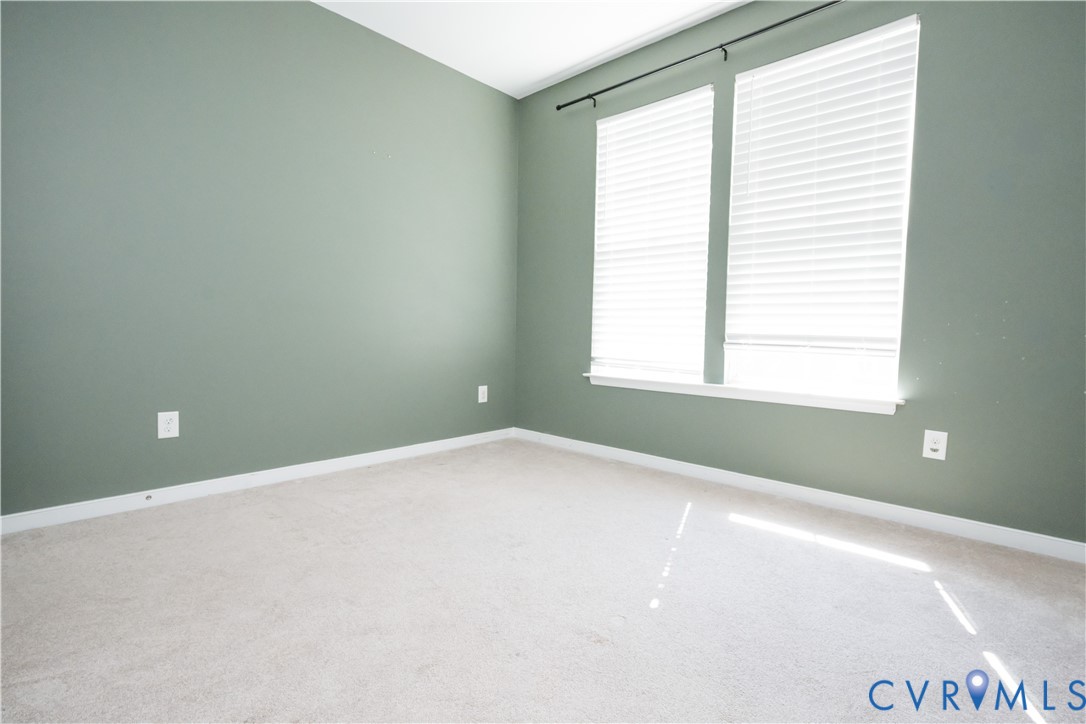 14536 Needham Market Road Midlothian, VA 23112 - Photo 18 of 25 Neutral-toned carpeting, light green wall paint, a