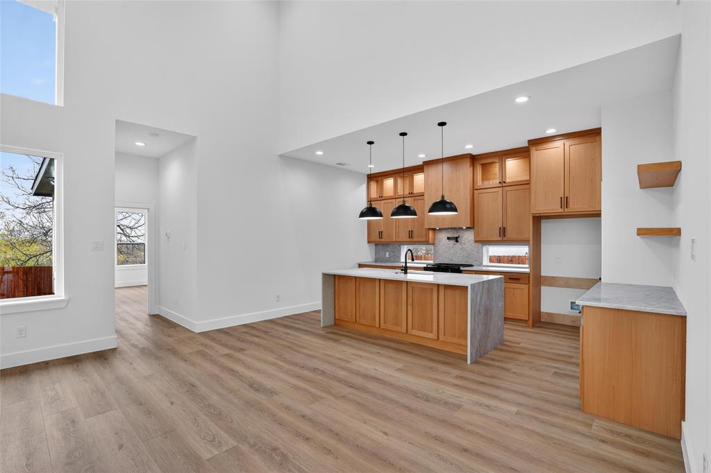 2007 North Montclair Avenue Dallas, TX 75208 - Photo 11 of 31 a kitchen with stainless steel appliances wooden floors and view living room