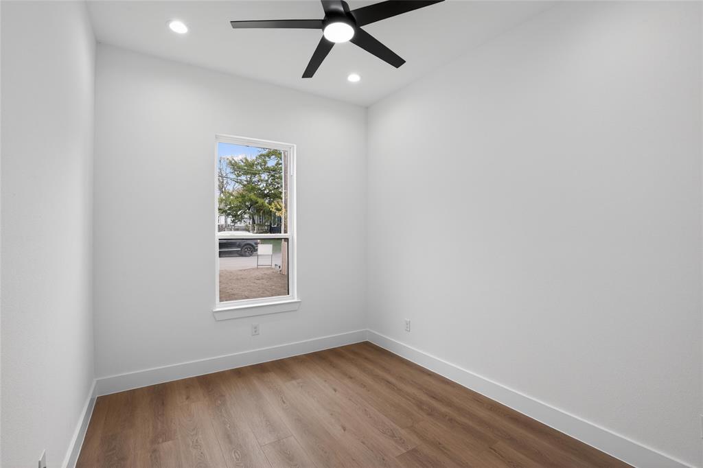 2007 North Montclair Avenue Dallas, TX 75208 - Photo 19 of 31 an empty room with wooden floor ceiling fan and windows