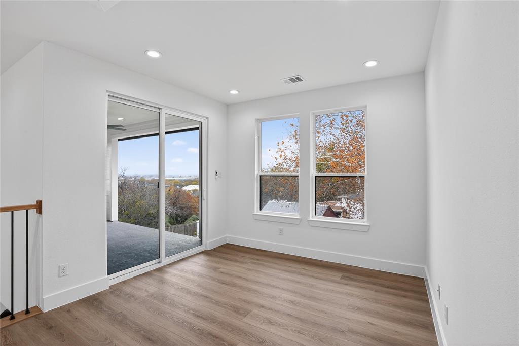 2007 North Montclair Avenue Dallas, TX 75208 - Photo 21 of 31 an empty room with wooden floor and windows