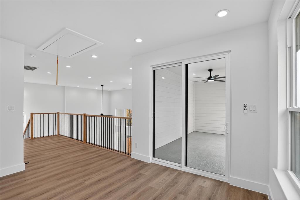 2007 North Montclair Avenue Dallas, TX 75208 - Photo 22 of 31 an empty room with wooden floor and windows