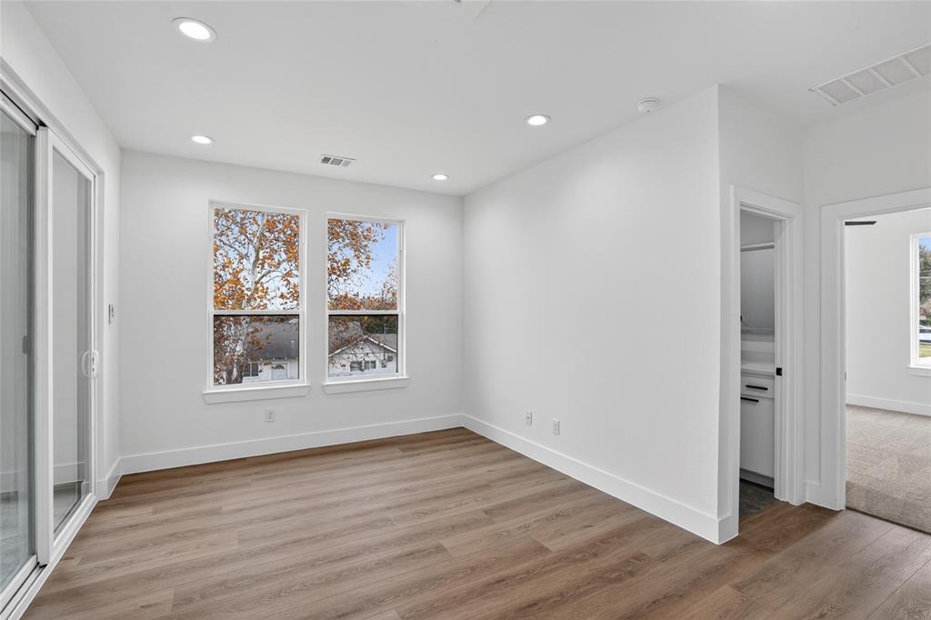 2007 North Montclair Avenue Dallas, TX 75208 - Photo 28 of 31 an empty room with wooden floor and window