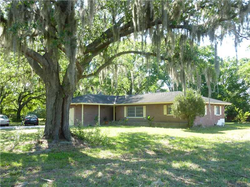 3316 Keystone Road Tarpon Springs, FL 34688 - Photo 1 of 1 front view of a house with a yard