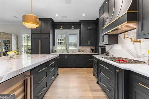 a kitchen with a stove and a kitchen island