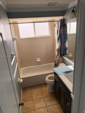 a room with a door open to a room