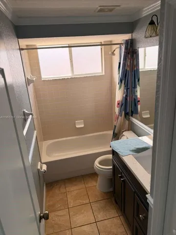 a room with a door open to a room