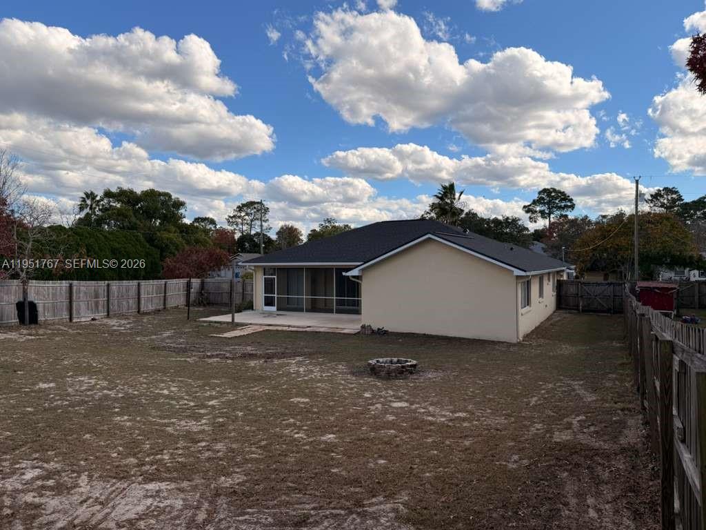 6229 Gainsboro Avenue Spring Hill, FL 34609 - Photo 6 of 25 a view of a house with a yard