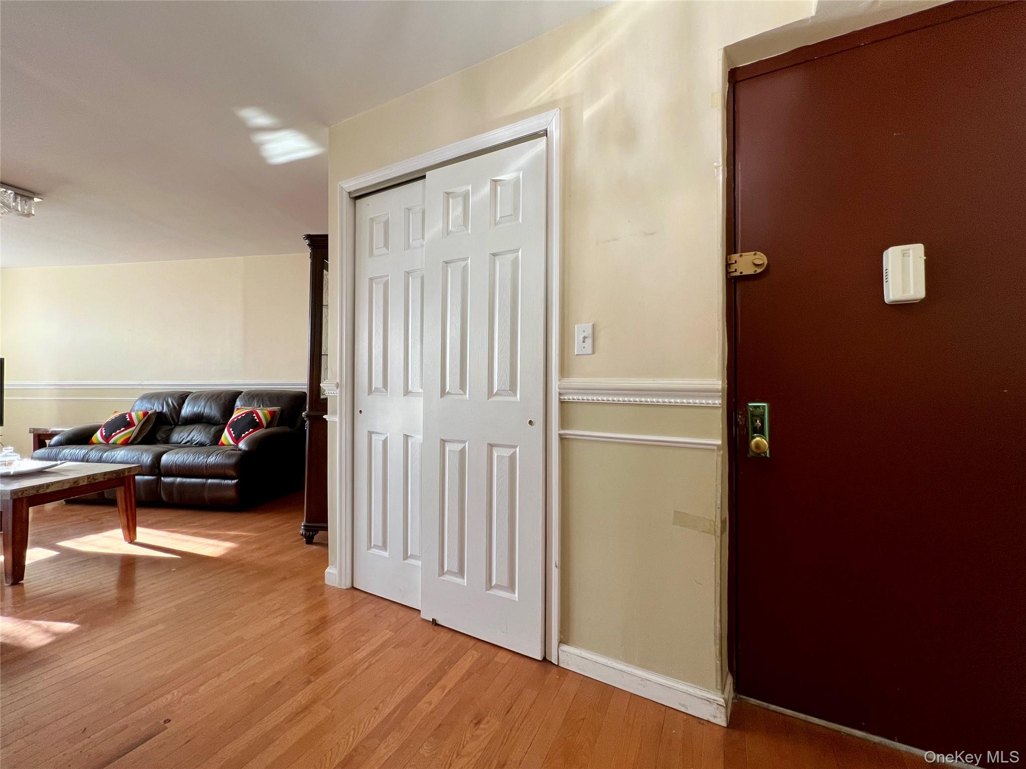 86-16 60th Avenue, Unit 2D Queens, NY 11373 - Photo 2 of 30 a view of a livingroom with furniture and staircase
