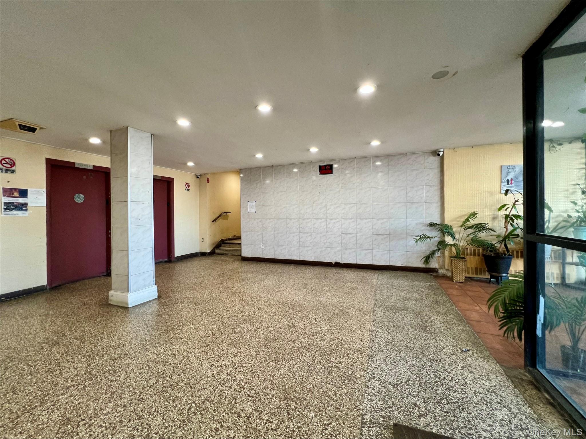 86-16 60th Avenue, Unit 2D Queens, NY 11373 - Photo 21 of 30 a view of a room with gym equipment