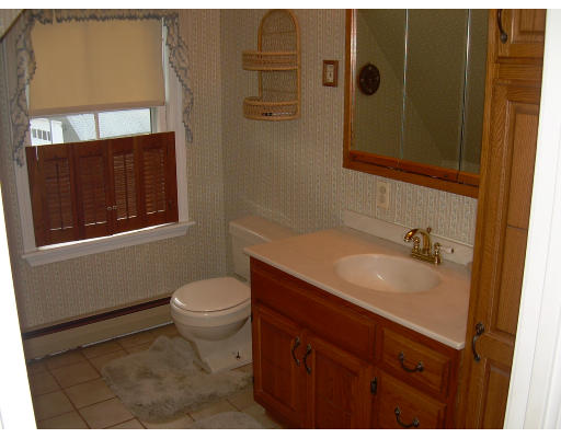 20 Mission Road Tyngsborough, MA 01879 - Photo 14 of 27 a bathroom with a sink a toilet and shower
