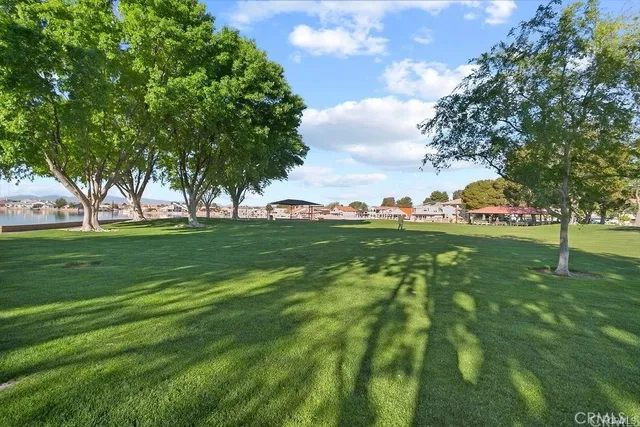 a view of grassy field with benches