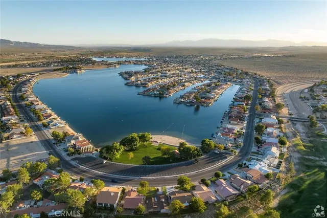 an aerial view of a house with a lake view
