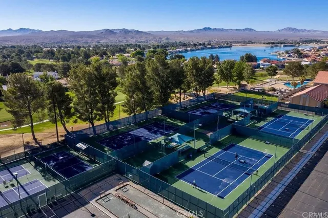 an aerial view of a residential houses with outdoor space