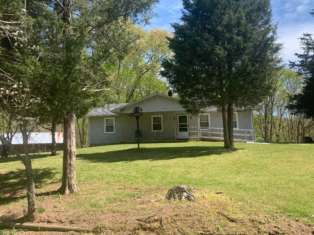 2210 Parrish Road, Unit 2214 Goodview, VA 24095 - Photo 1 of 6 a front view of a house with a yard