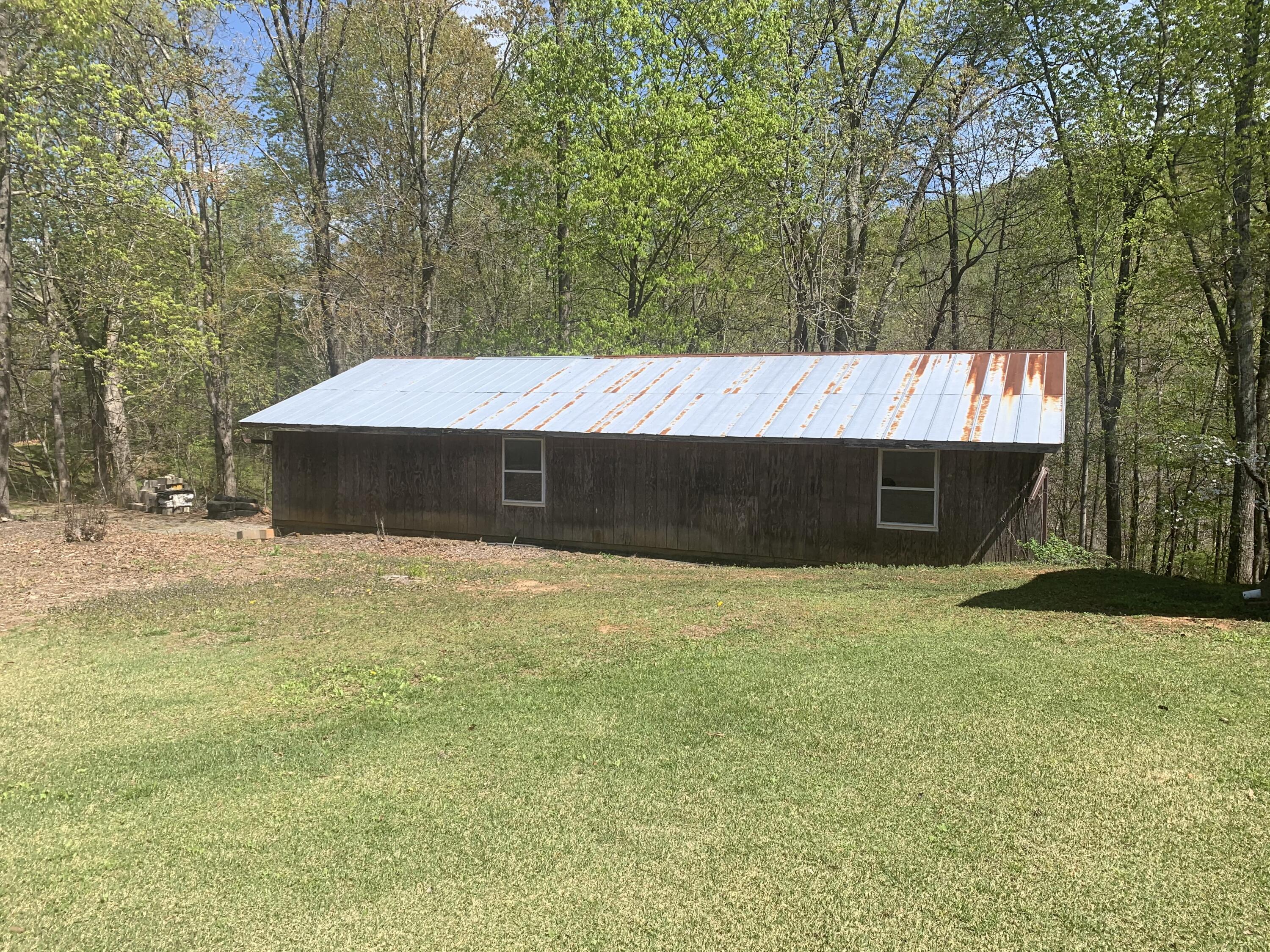 2210 Parrish Road, Unit 2214 Goodview, VA 24095 - Photo 6 of 6 a backyard of a house with lots of green space