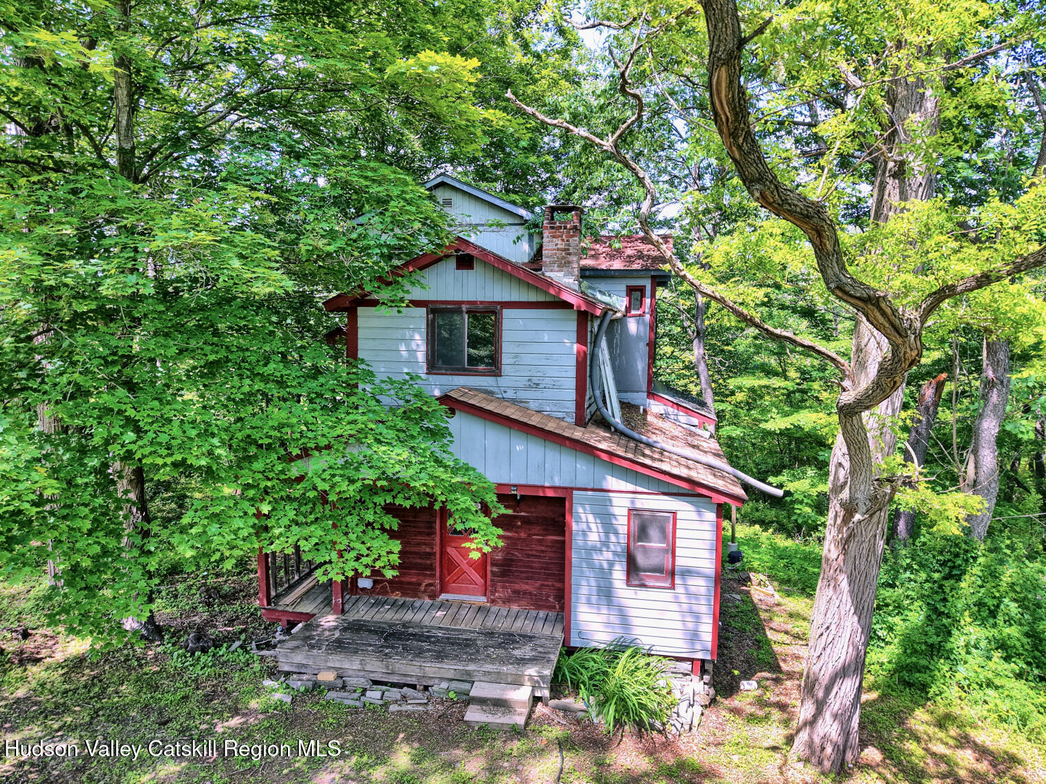 360 Stone Bridge Rd Extension East Durham, NY 12423 - Photo 58 of 83 a front view of a house with a garden