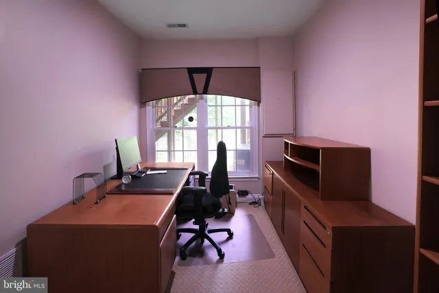 a view of a workspace with furniture