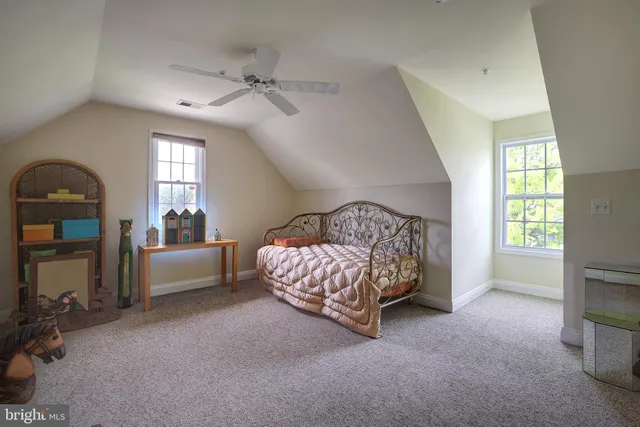 a bedroom with a bed and a balcony view