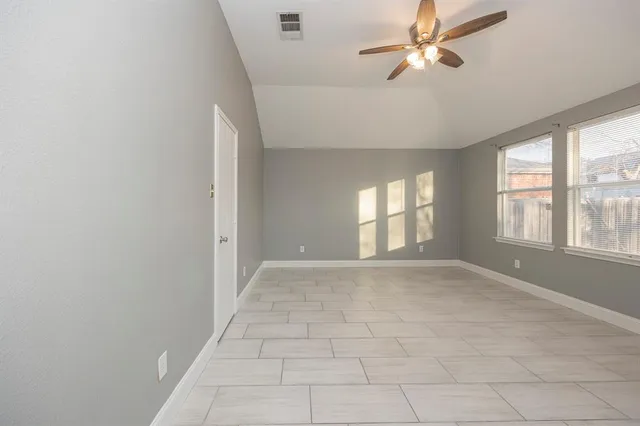 a view of an empty room with a window