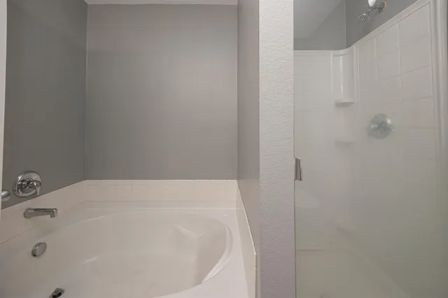 a bathroom with a white bath tub
