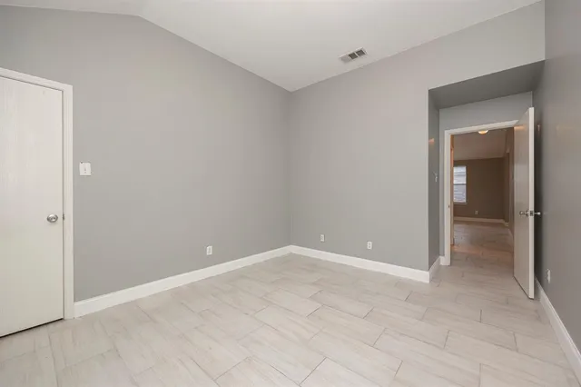 a view of a backyard with large trees