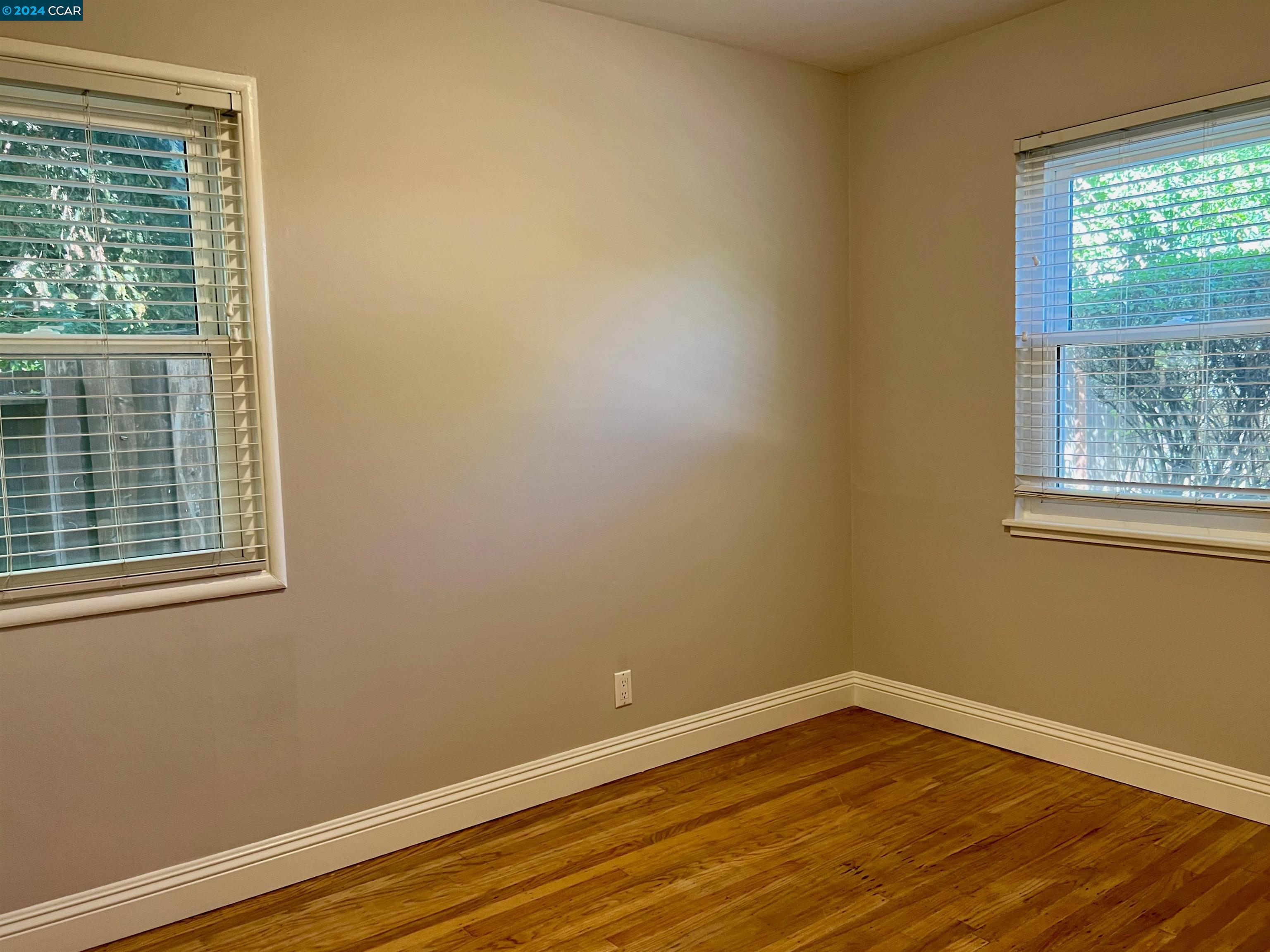 1282 Windermere Way Concord, CA 94521 - Photo 14 of 21 a view of an empty room with wooden floor and a window