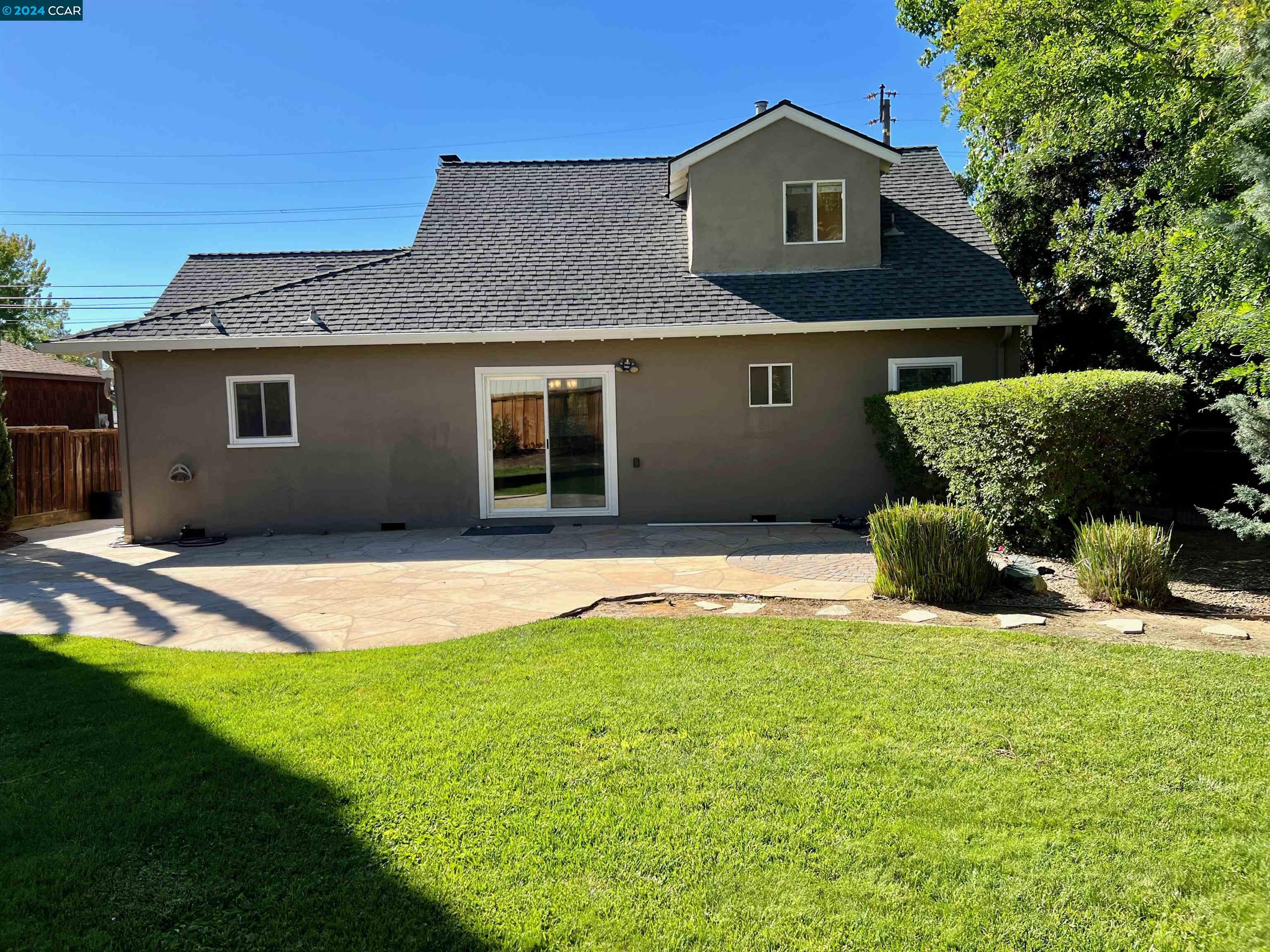 1282 Windermere Way Concord, CA 94521 - Photo 18 of 21 a view of a house with a yard and garage
