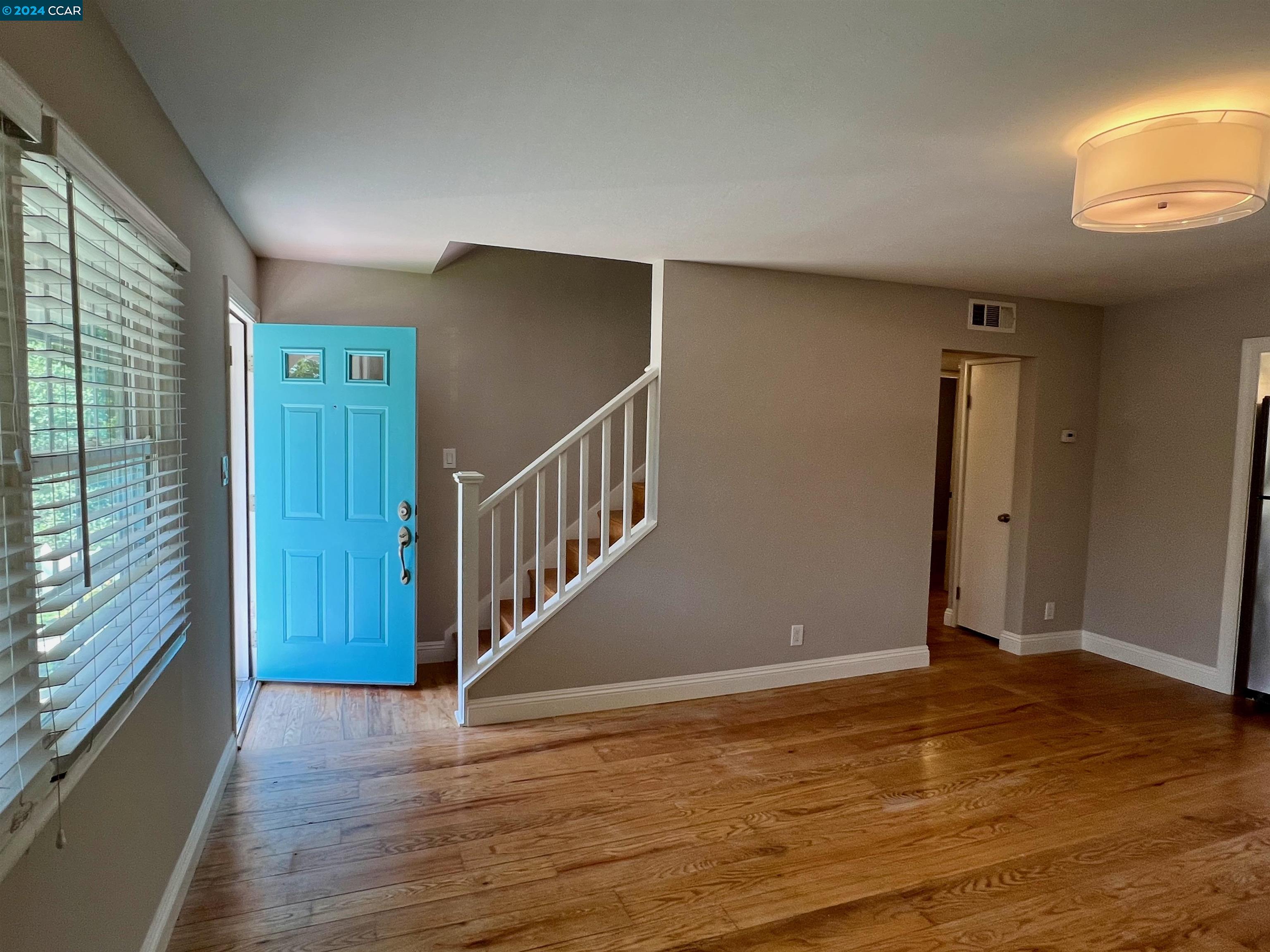 1282 Windermere Way Concord, CA 94521 - Photo 3 of 21 a view of an entryway with wooden floor